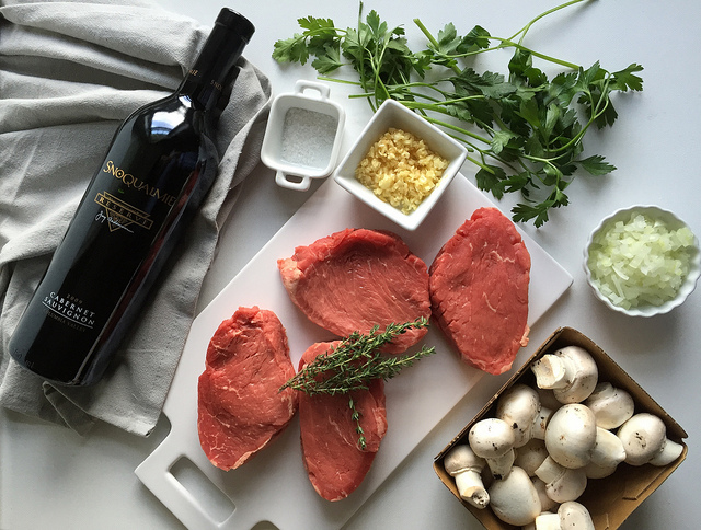 Beef with Red Wine Mushroom Sauce - an easy to prepare beef recipe with restaurant quality appeal and flavor! Just sear tenderloin steaks and saute a thyme-infused mushroom sauce using a dry red wine like cabernet sauvignon