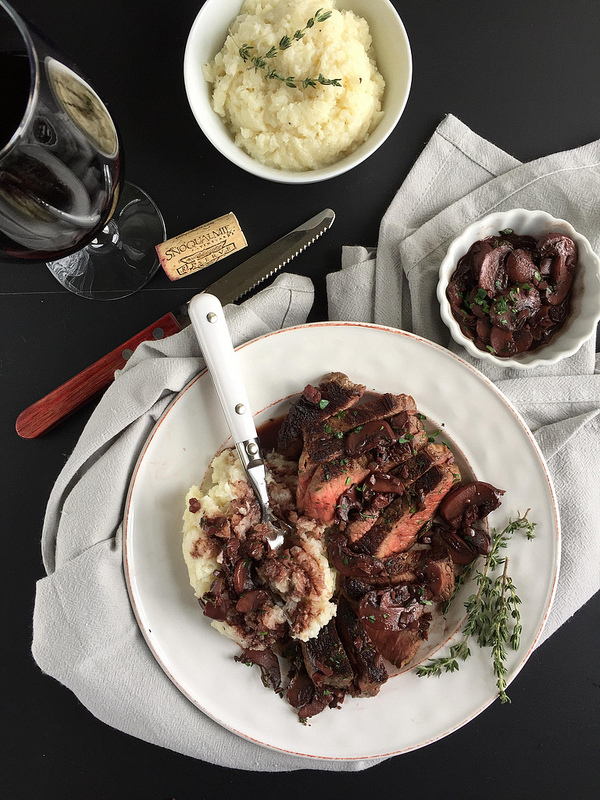 Beef with Red Wine Mushroom Sauce - an easy to prepare beef recipe with restaurant quality appeal and flavor! Just sear tenderloin steaks and saute a thyme-infused mushroom sauce using a dry red wine like cabernet sauvignon