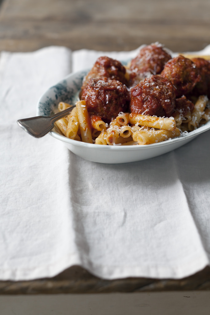 The Best Meatballs and Sauce Recipe! These meatballs are as tender as can be. Soft and seasoned with oregano and mint - the secret ingredient in my family's decades-old recipe. You'd never be able to pinpoint what that lovely flavor is, because it's not overtly minty, just subtlely fragrant and herbal. The sauce is rich, sweet, and garlicky and the meatballs are cooked right in the sauce, allowing them to retain their moisture, and giving the sauce even more flavor | andiemitchell.com