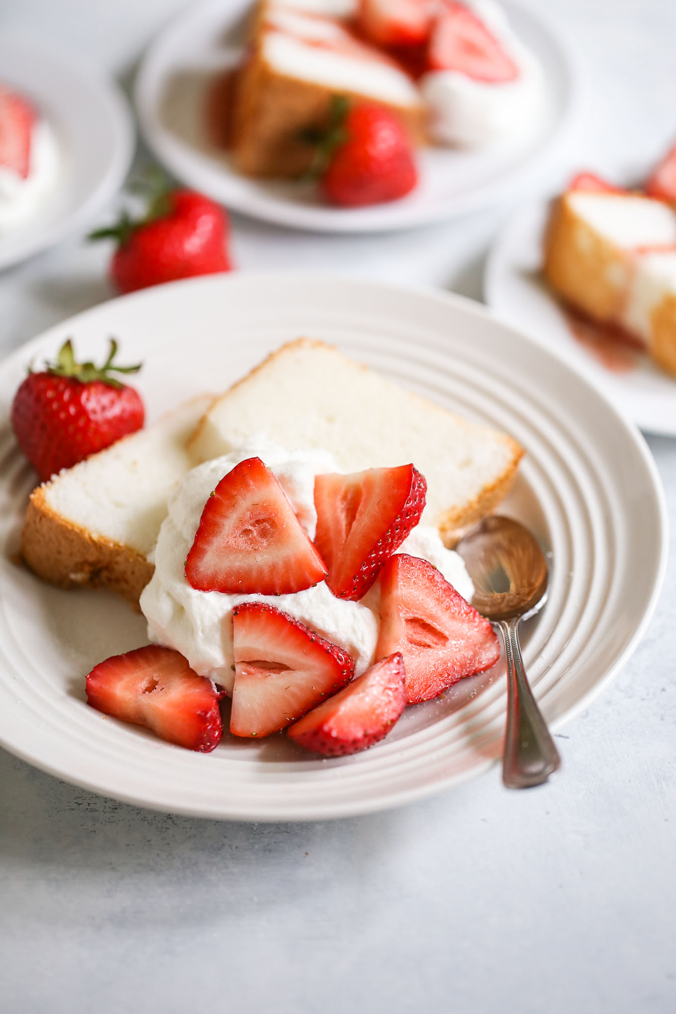 Strawberry shortcakes made with angel food cake, fresh strawberries, and whipped cream