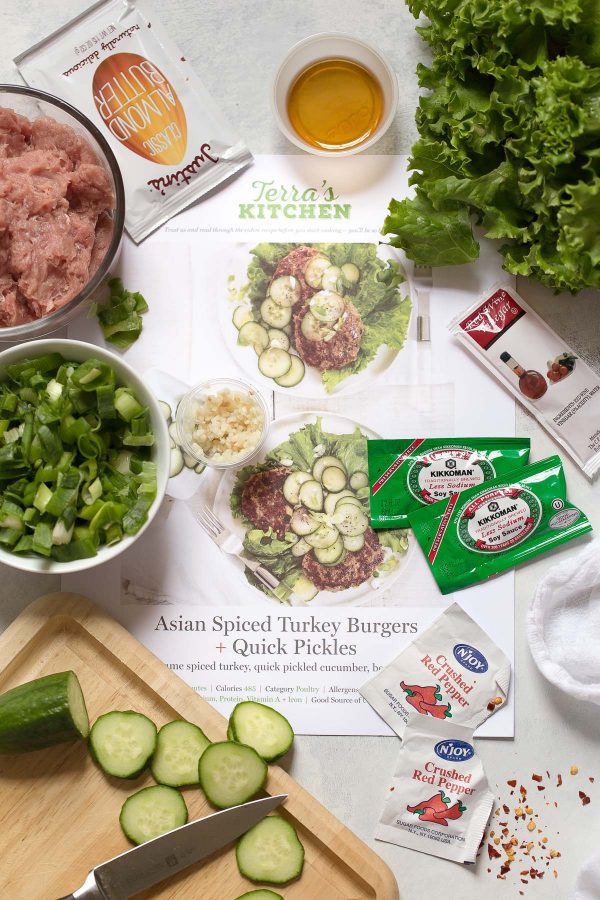 Asian Turkey Burgers Recipe with Quick Pickles - an easy super flavorful turkey burger made with scallions, soy sauce, garlic, and peanut butter or almond. Top them with cucumbers tossed salt and vinegar to make pickles in minutes! Recipe and review of Terra's Kitchen meal delivery service