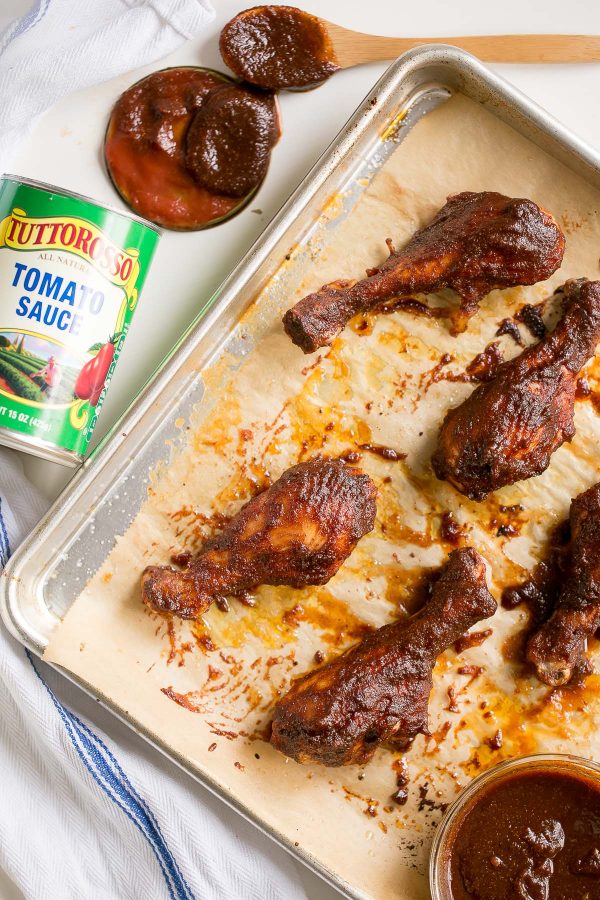 Chicken Drumsticks with Easy Homemade BBQ Sauce Recipe - In just 15 minutes of simmering, you’ll have an irresistible smoky, tangy, and sweet homemade BBQ sauce - made without ketchup, only canned tomato sauce, a little brown sugar, molasses, and spices - to slather on skinless chicken drumsticks! Serve them as an appetizer, game day snack, or entree.