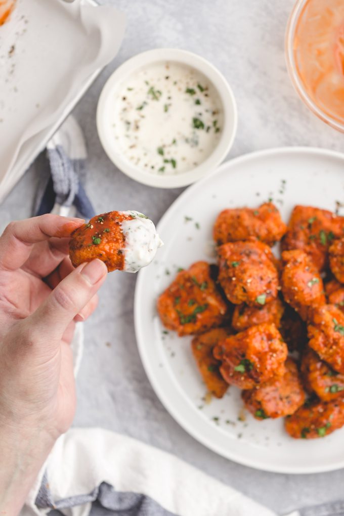 Healthier Baked Buffalo Chicken Nuggets for 418 calories or 6 WW points! This easy recipe is lighter comfort food, with crispy breading, spicy sauce, and cool, creamy blue cheese dressing