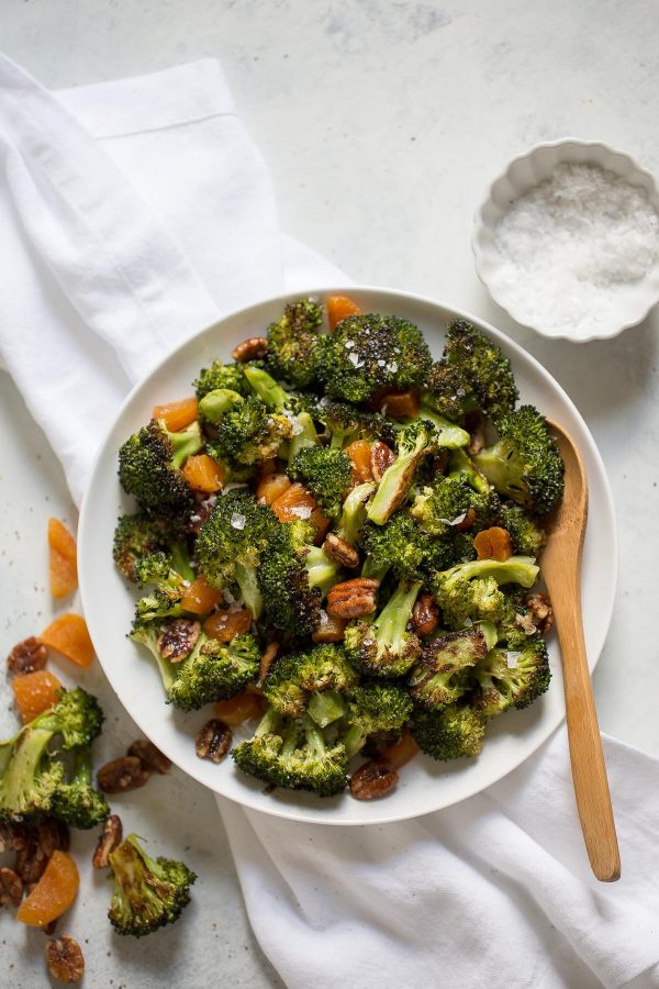 Broccoli salad with apricots and pecans is salty sweet, with roasted broccoli! This recipe is quick and easy to make, has only 5 ingredients, and is great as a potluck side dish.