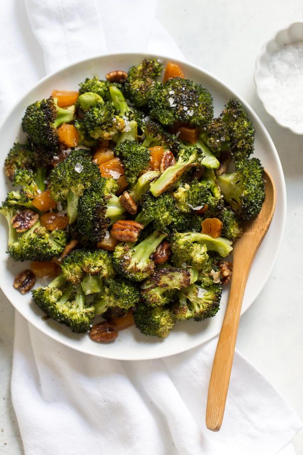 Broccoli salad with apricots and pecans is salty sweet, with roasted broccoli! This recipe is quick and easy to make, has only 5 ingredients, and is great as a potluck side dish.