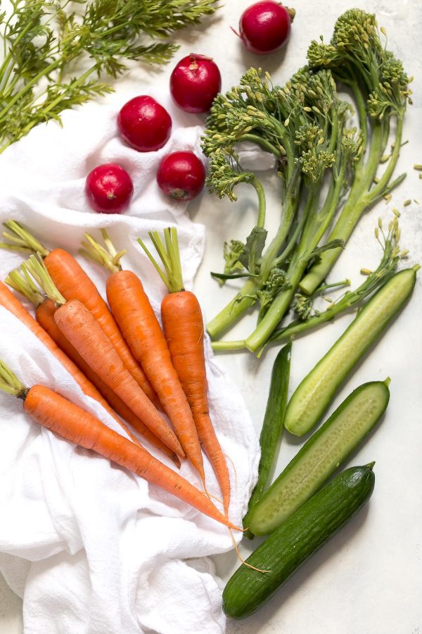 How to make a better vegetable platter with recipes for tandoori spice carrots, lemon broccolini, radishes, cucumbers, tomatoes - any seasonal veggies - and an easy cream cheese to dip! 
