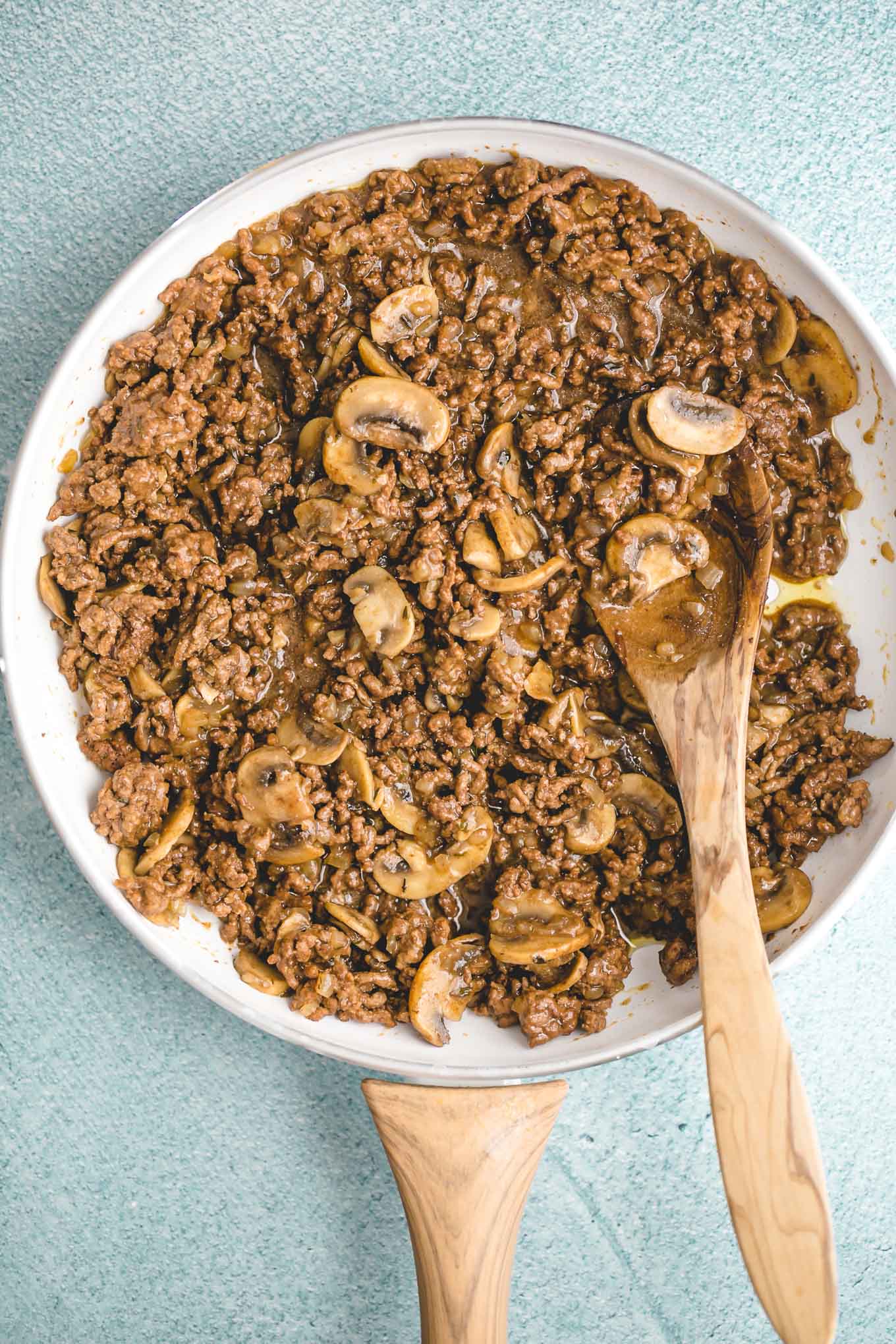 Creamy Cheeseburger Skillet with Mushrooms and Swiss! A deliciously creamy, cheesy, fully-loaded cheeseburger skillet that the whole family will love. Make it in just 30 minutes with ground beef, mushrooms, onions, cream cheese, and Swiss cheese. 