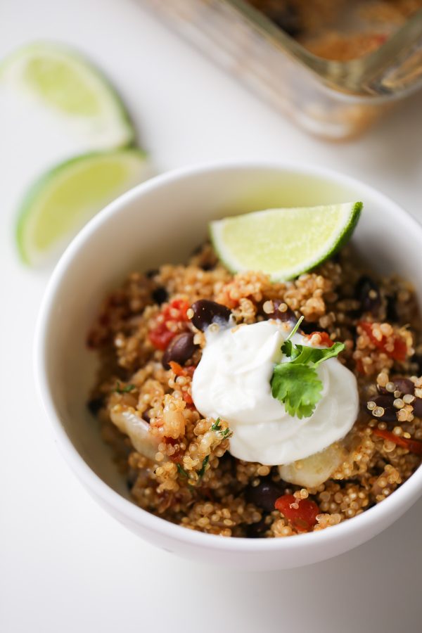 Cheesy Mexican Quinoa and Black Bean Casserole - This easy casserole recipe is vegetarian, SATISFYING, and healthy! It can be made in 1 pan in no time, too! 343 calories per bowl