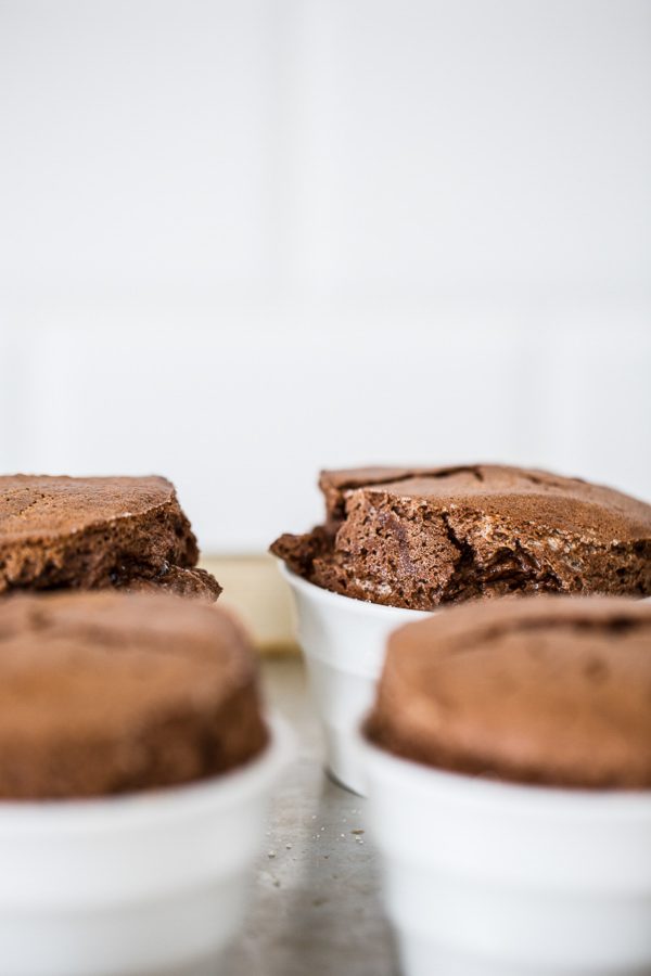 Chocolate Souffle with White Chocolate Sauce - love souffle? Here's a way to enjoy the rich, decadent chocolate dessert in individual servings for half the fuss and only 253 calories! Drizzle with white chocolate sauce and it's a quick dinner party dessert or dessert for one, two, or just a few! #healthy #treat