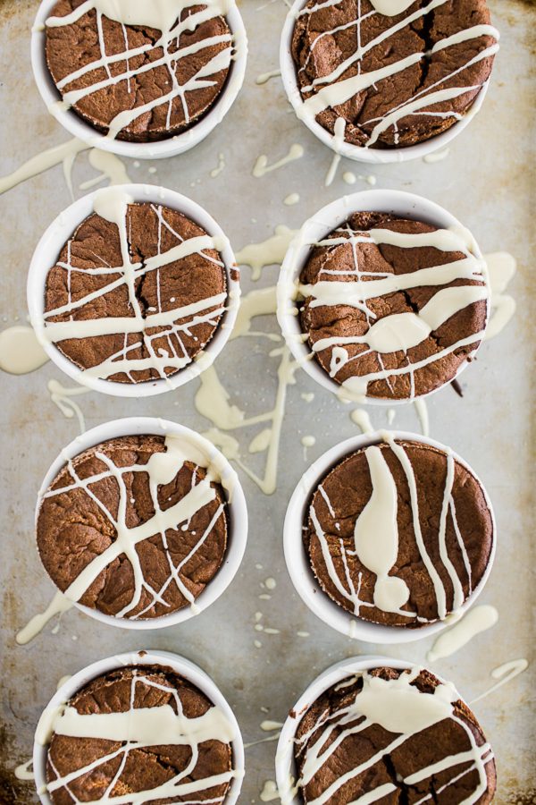 Chocolate Souffle with White Chocolate Sauce - love souffle? Here's a way to enjoy the rich, decadent chocolate dessert in individual servings for half the fuss and only 253 calories! Drizzle with white chocolate sauce and it's a quick dinner party dessert or dessert for one, two, or just a few! #healthy #treat