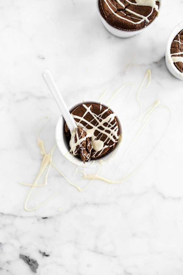 Chocolate Souffle with White Chocolate Sauce - love souffle? Here's a way to enjoy the rich, decadent chocolate dessert in individual servings for half the fuss and only 253 calories! Drizzle with white chocolate sauce and it's a quick dinner party dessert or dessert for one, two, or just a few! #healthy #treat