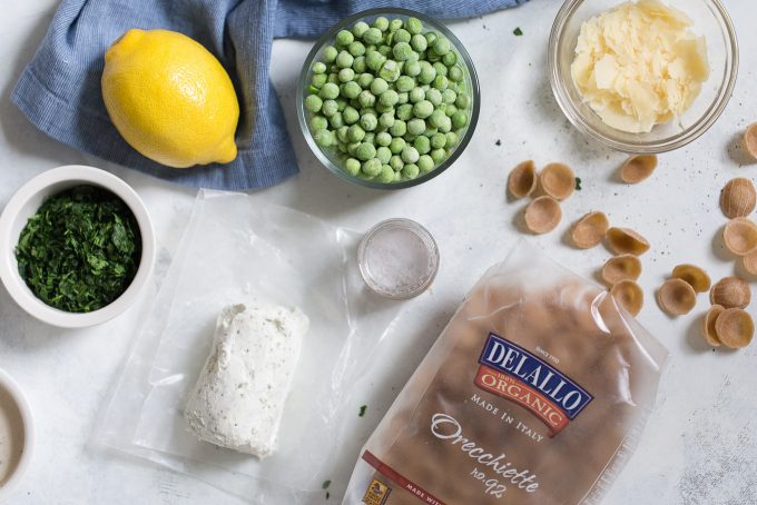 Creamy Orecchiette with Goat Cheese and Tuna Recipe - Move over tuna noodle casserole! This comfort food pasta dish is made with whole wheat orecchiette, herbed goat cheese, canned tuna, and sweet peas! 