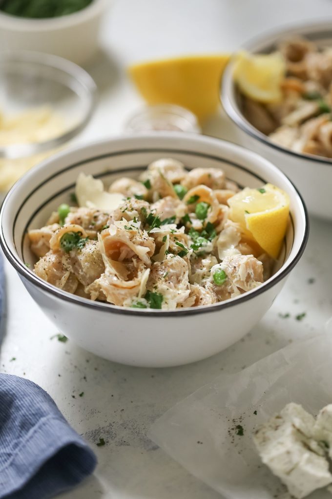 Creamy Orecchiette with Goat Cheese and Tuna Recipe - Move over tuna noodle casserole! This comfort food pasta dish is made with whole wheat orecchiette, herbed goat cheese, canned tuna, and sweet peas! 