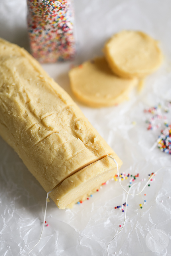 Easy Slice and Bake Sugar Cookie Recipe - these sugar cookies are so easy to make and only 77 calories each! Make the dough, form it into a log, wrap it in wax paper, and freeze - voila! Homemade slice and bake cookies!