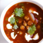 Vegetarian Tortilla Soup Recipe with Chili Roasted Chickpeas! A flavor powerhouse! This vegetarian soup recipe is rich with Mexican flavors like cumin and chili powder, and mildly spicy from sautéed jalapeño pepper. Top the soup with these garlic, oregano, and chili roasted chickpeas to make the soup lighter than traditional versions that have fried tortilla strips, while also boosting the protein and fiber!