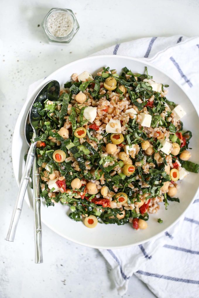 farro salad with kale, sun dried tomatoes, mozzarella, chickpeas, and olives