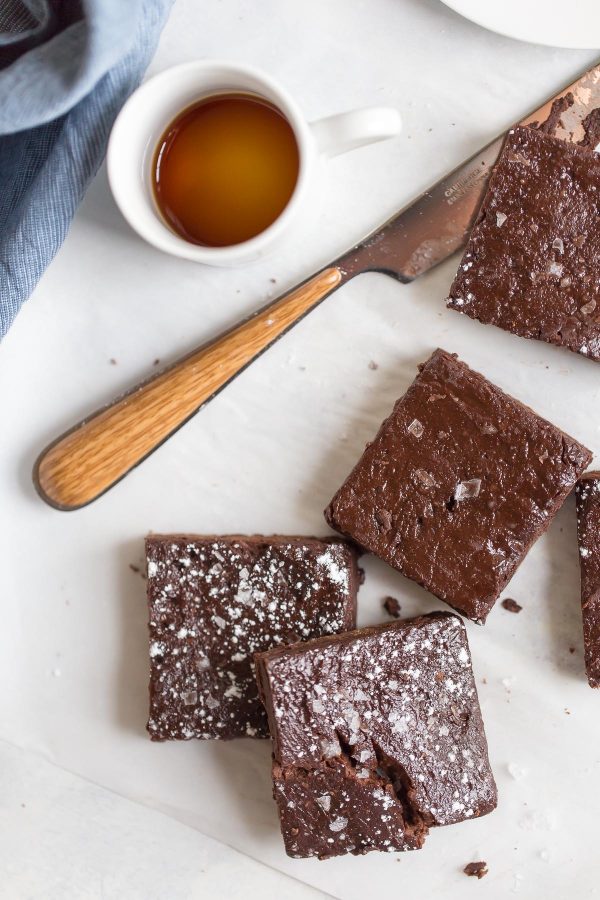 Fudgy 100 Calorie Healthy Brownies - For 100 calories, enjoy fudgy, healthy brownies rich with dark chocolate flavor. Recipe is made with white whole wheat flour, maple syrup, and greek yogurt