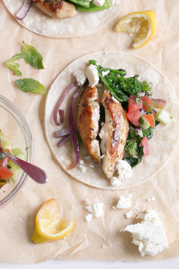 Greek chicken fajitas with broccoli rabe and fresh flavors like lemon, oregano, feta cheese, parsley, and mint. Try this easy weeknight recipe for a Mediterranean spin on traditional fajitas! #broccolirabe