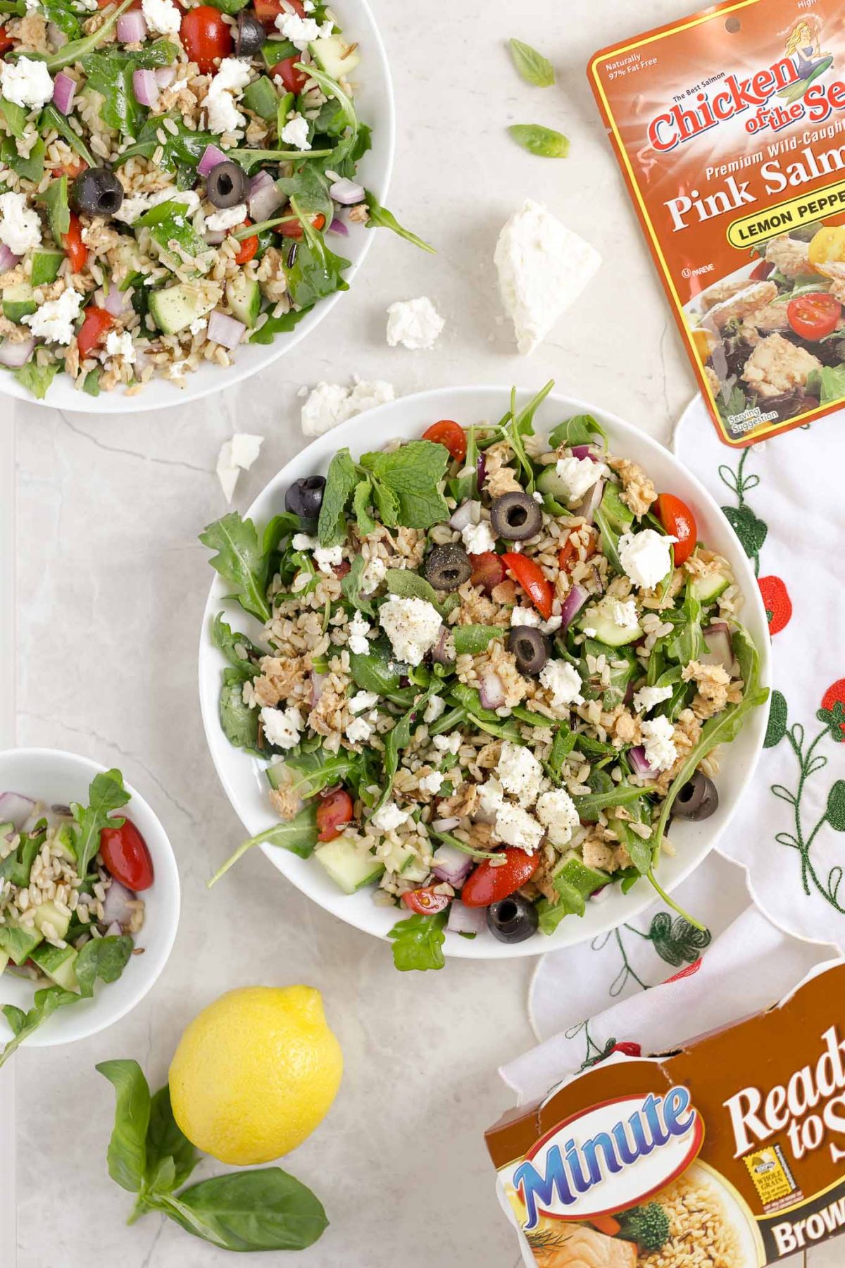 Greek Whole Grain Salad with Lemon Salmon and Feta - A delicious whole grain salad with Greek flavors like feta, olives, lemon pepper salmon, and brown and wild rice! It's quick, easy, and filling! 
