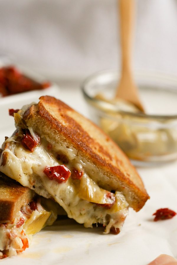Grilled Cheese with Havarti Sun Dried Tomatoes Prosciutto and Artichokes! This Italian-style grilled cheese sandwich recipe is PACKED with flavor and delicious melty Arla Havarti cheese