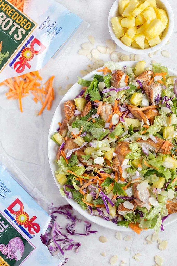 Hawaiian Salad with Pineapple Chicken - This healthy, tropical salad has ginger-soy marinated chicken, pineapple chunks, romaine lettuce, red cabbage, carrots, almonds, and a soy sauce and sesame vinaigrette!