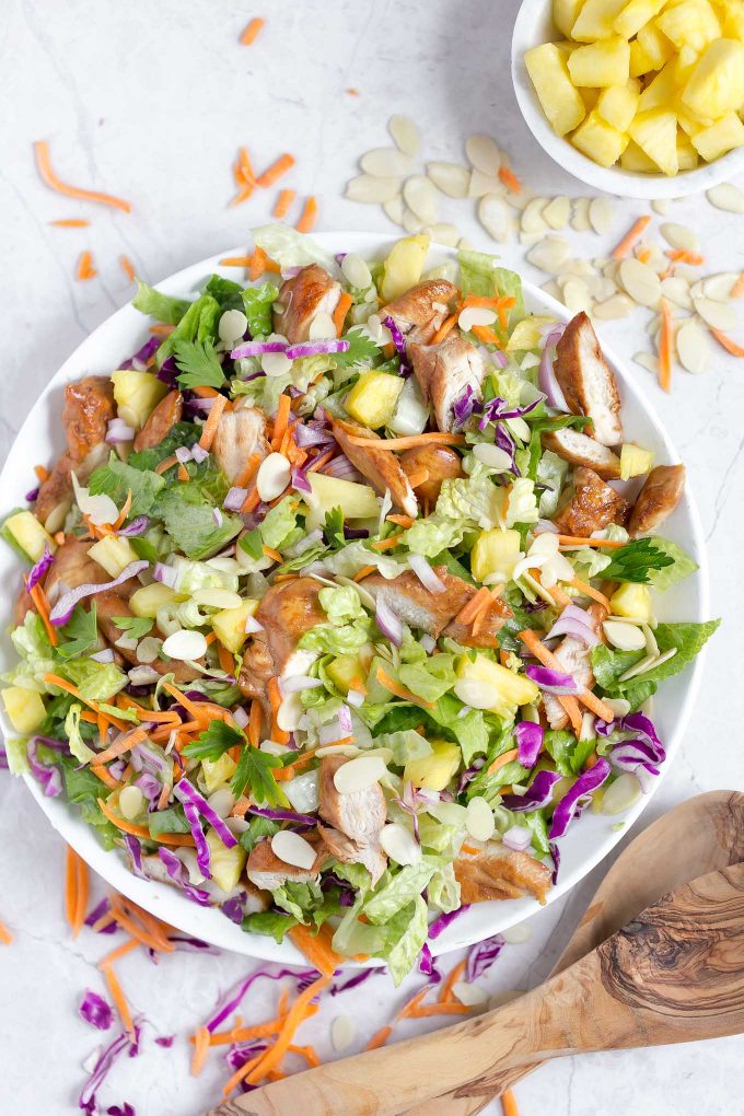 Hawaiian Salad with Pineapple Chicken - This healthy, tropical salad has ginger-soy marinated chicken, pineapple chunks, romaine lettuce, red cabbage, carrots, almonds, and a soy sauce and sesame vinaigrette!