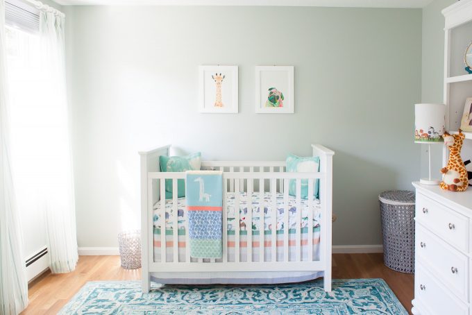 baby boy nursery with white furniture and cool blue green details