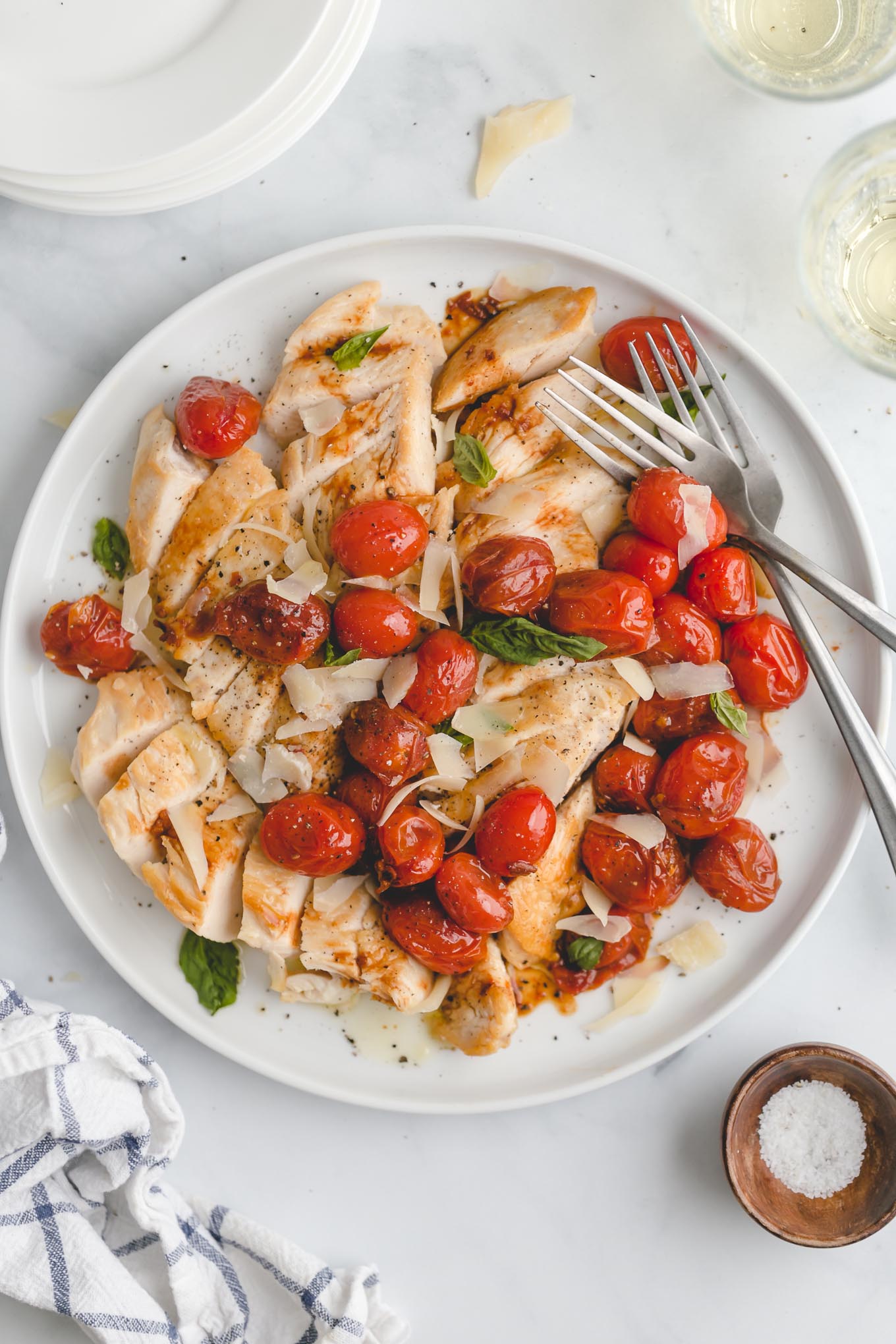 one pan chicken topped with sautéed grape tomatoes, garlic, and balsamic vinegar