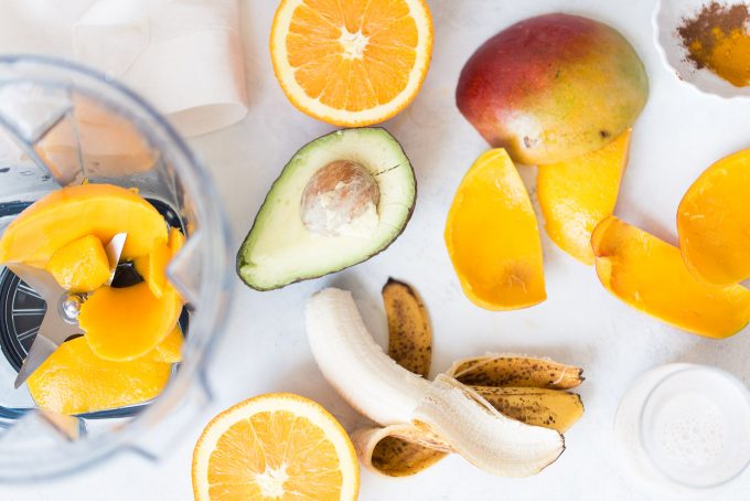 Orange Mango Turmeric Smoothie Bowl Recipe! Made with fresh orange juice, mango, banana, avocado, cinnamon, turmeric, and nutmeg! A healthy and delicious breakfast that's dairy free and vegan 