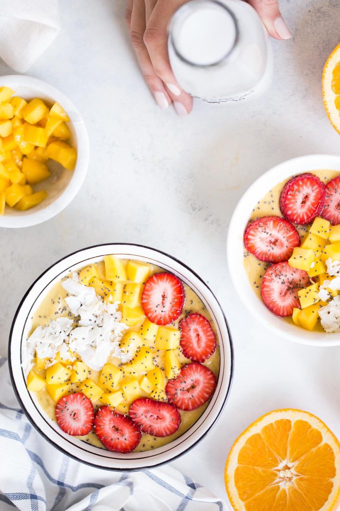 Orange Mango Turmeric Smoothie Bowl Recipe! Made with fresh orange juice, mango, banana, avocado, cinnamon, turmeric, and nutmeg! A healthy and delicious breakfast that's dairy free and vegan 