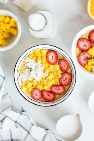 Orange Mango Turmeric Smoothie Bowl Recipe! Made with fresh orange juice, mango, banana, avocado, cinnamon, turmeric, and nutmeg! A healthy and delicious breakfast that's dairy free and vegan