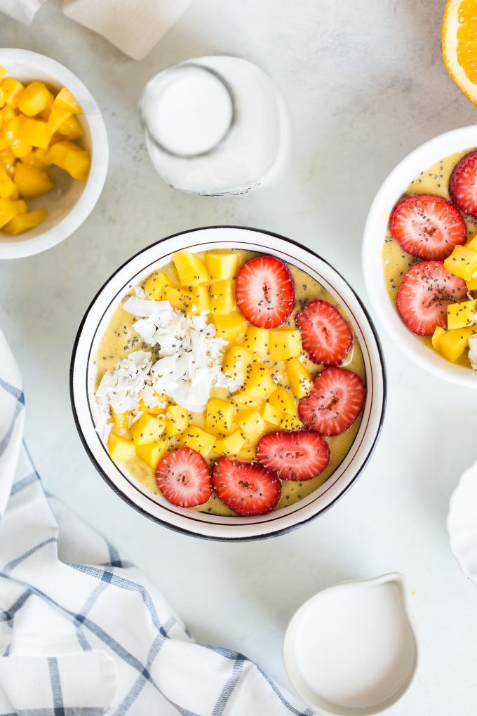 Orange Mango Turmeric Smoothie Bowl Recipe! Made with fresh orange juice, mango, banana, avocado, cinnamon, turmeric, and nutmeg! A healthy and delicious breakfast that's dairy free and vegan 