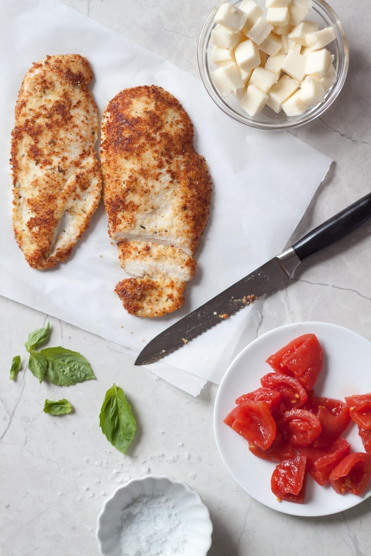Parmesan Crusted Chicken Caprese Salad Recipe - A spruced up caprese salad made with arugula, radicchio, mozzarella, tomatoes, and crispy chicken cutlets breaded with almond meal and Parmesan!Parmesan Crusted Chicken Caprese Salad Recipe - A spruced up caprese salad made with arugula, radicchio, mozzarella, tomatoes, and crispy chicken cutlets breaded with almond meal and Parmesan!