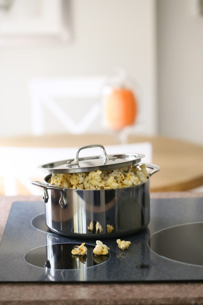 making popcorn on the stove