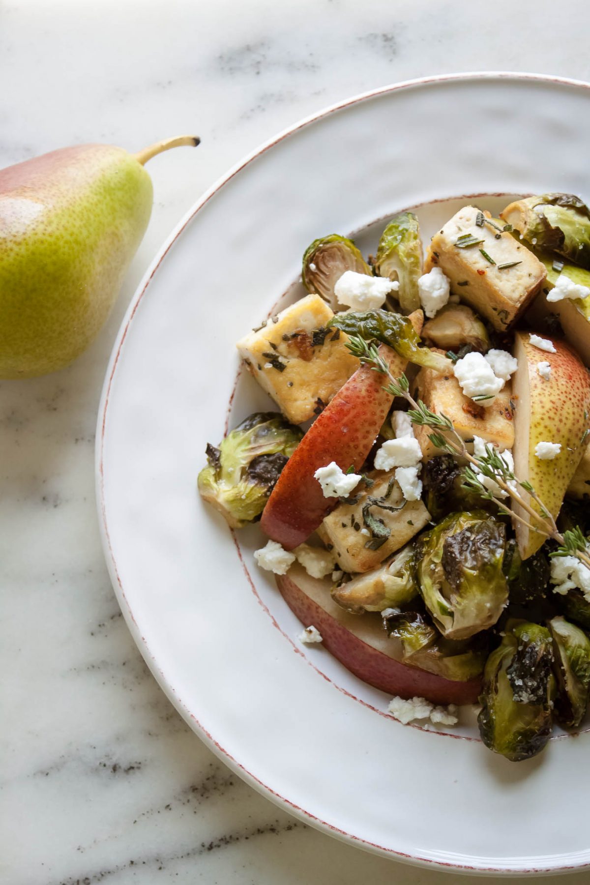 Rosemary Sage Tofu with Roasted Brussels Sprouts, Pear, and Goat Cheese - This healthy vegetarian salad recipe is perfect for fall and any holiday table!