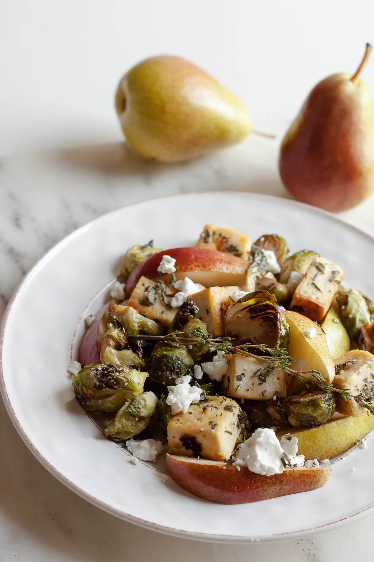 Rosemary Sage Tofu with Roasted Brussels Sprouts, Pear, and Goat Cheese - This healthy vegetarian salad recipe is perfect for fall and any holiday table!