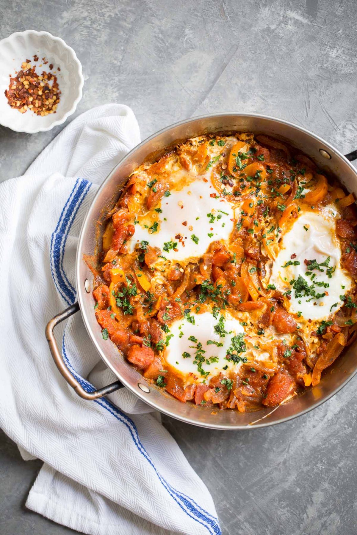 Easy Shakshuka Recipe - an easy and healthy breakfast of eggs simmered in a rich Moroccan spiced tomato sauce! 