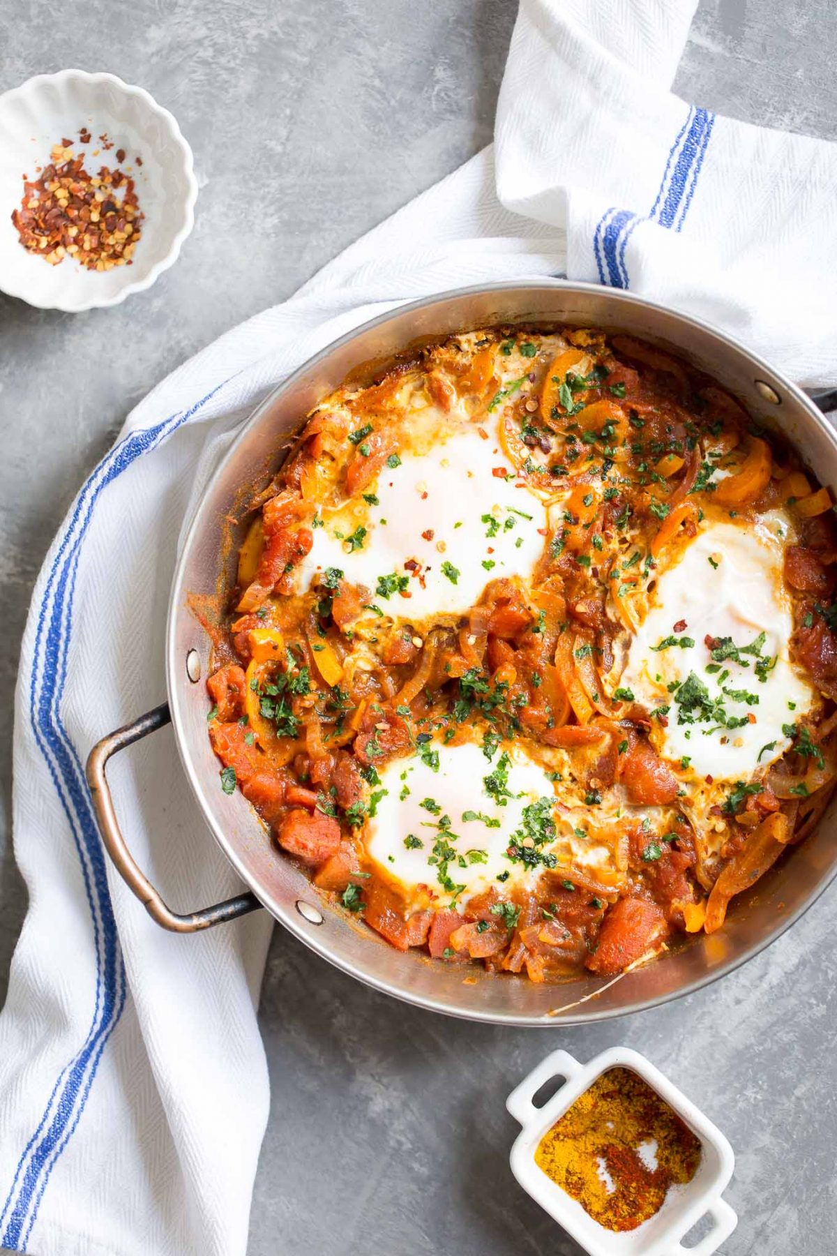 Easy Shakshuka Recipe - an easy and healthy breakfast of eggs simmered in a rich Moroccan spiced tomato sauce! 