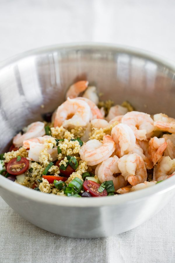 Quinoa Salad with Shrimp, Feta, Tomatoes, and Olives! This recipe is quick to make, refreshing, so light, and perfect to make ahead for lunch or even a party! It's one of those healthy salad recipes that can be served hot or cold!