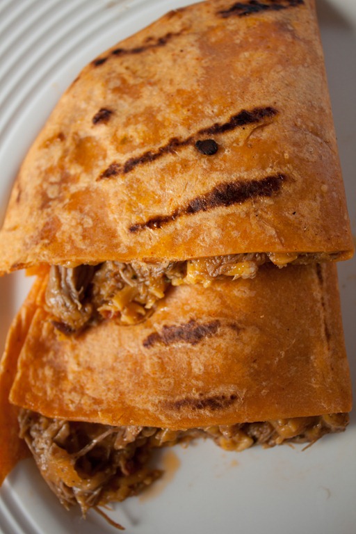 Slow Cooker Beef and Mango Quesadillas! The easiest ever recipe - make crock pot bbq beef then combine it with sliced mango and sharp cheddar in a tortilla for the ultimate quesadilla!