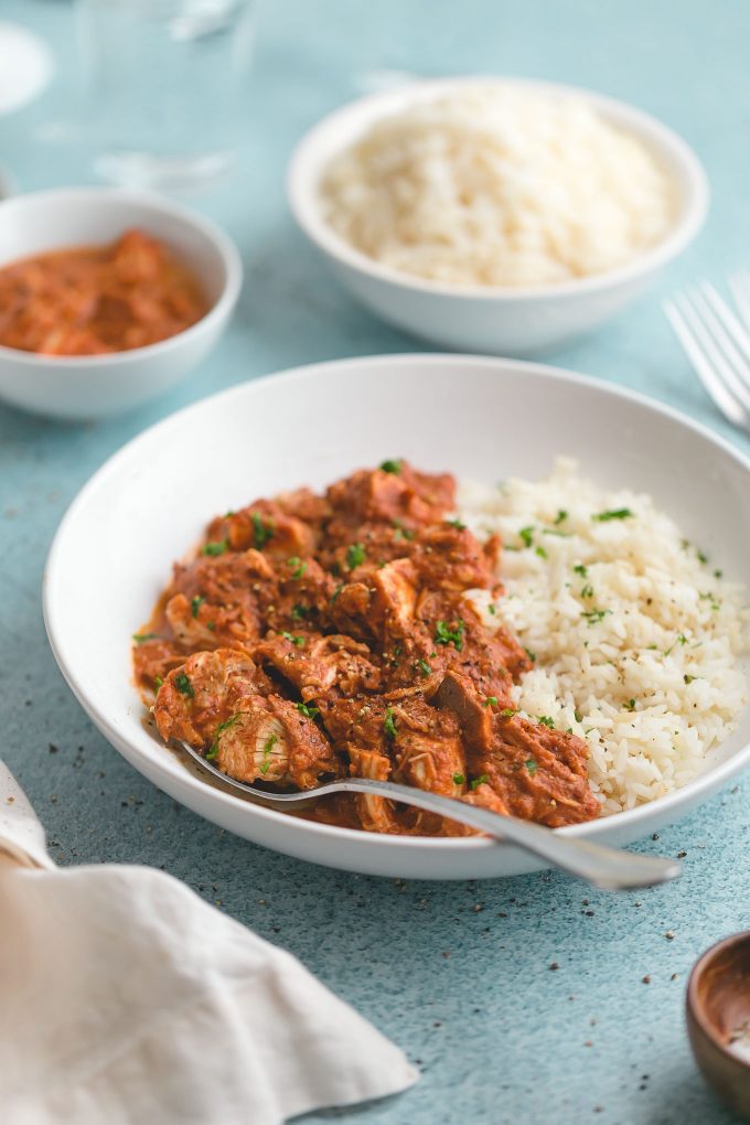 Slow Cooker Chicken Tikka Masala - all the big, bold flavor of the traditional dish, but it’s far easier—and lighter, too (263 calories or 3 Weight Watchers points). The chicken is fall-apart tender in a deliciously creamy, fragrant, slightly sweet, and subtlety tangy tomato sauce.