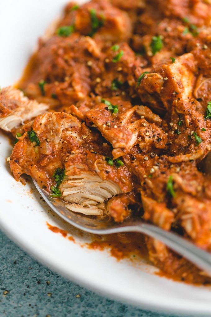Slow Cooker Chicken Tikka Masala - all the big, bold flavor of the traditional dish, but it’s far easier—and lighter, too (263 calories or 3 Weight Watchers points). The chicken is fall-apart tender in a deliciously creamy, fragrant, slightly sweet, and subtlety tangy tomato sauce.
