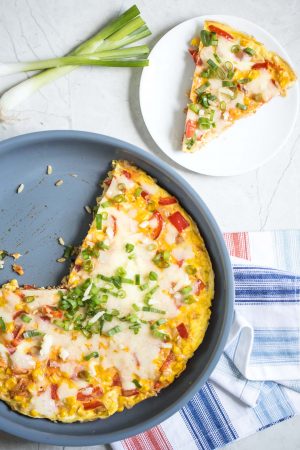 Southwestern Frittata Recipe- Here's how to make an easy breakfast egg frittata recipe with delicious southwestern flavor and plenty of texture! Features red pepper, corn, scallions and cheddar.