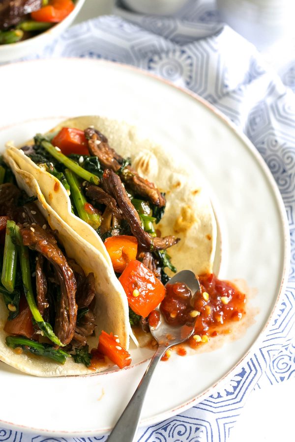 Spicy Beef Tacos Recipe with Broccoli Rabe - marinate your steak in a quick toasted sesame-soy dressing for a flavorful asian fusion taco recipe - paired with superfood broccoli rabe and stuffed in a corn tortilla! An easy weeknight dinner. 