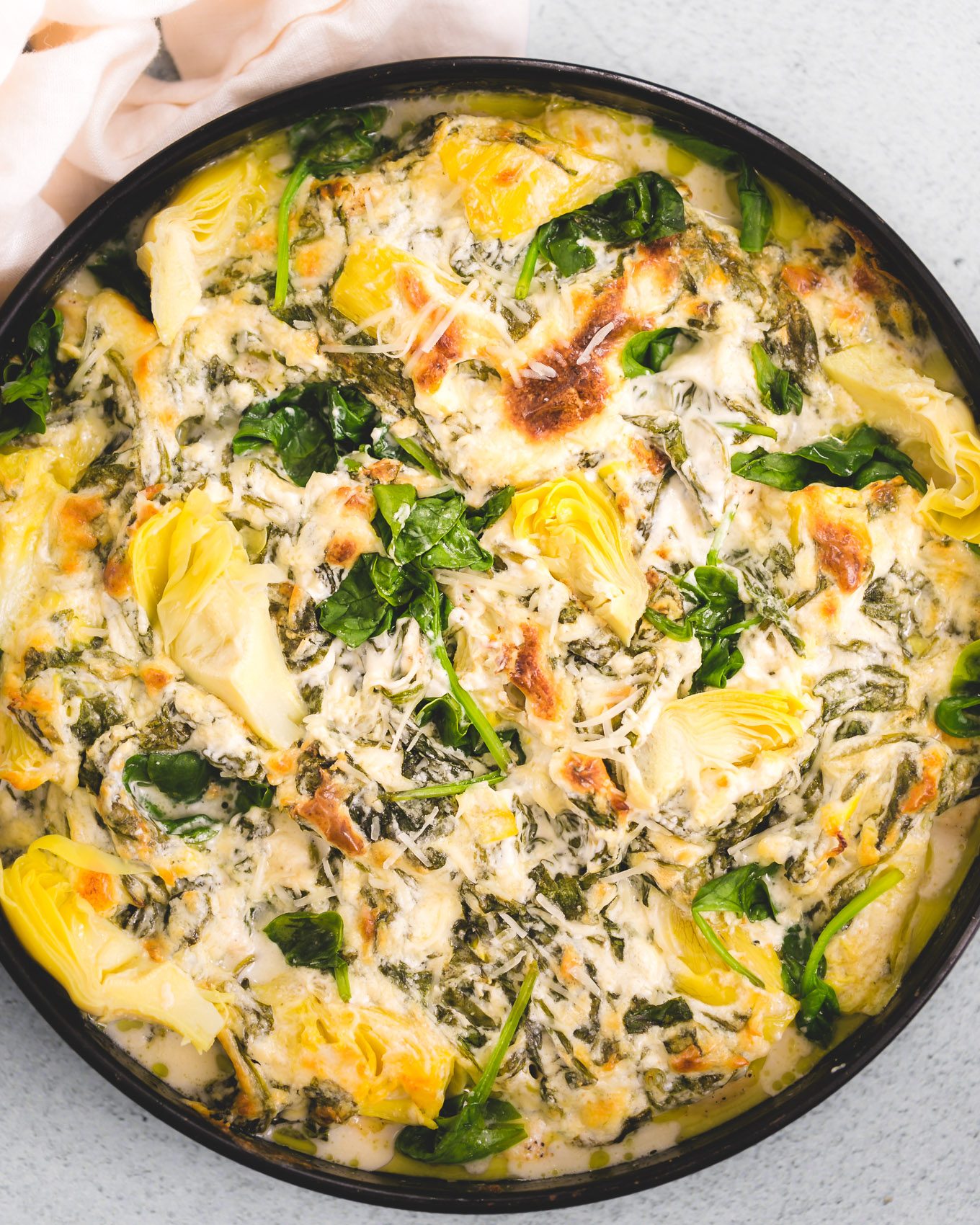 spinach and artichoke dip on top of chicken