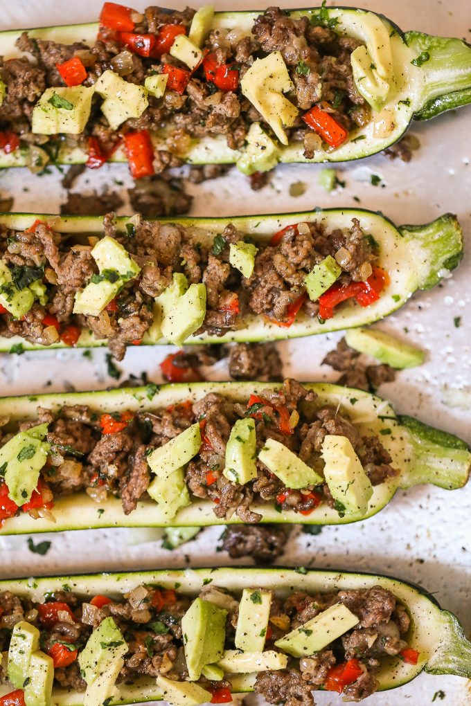 Stuffed Zucchini Recipe - made with spiced ground beef and topped with avocado! 