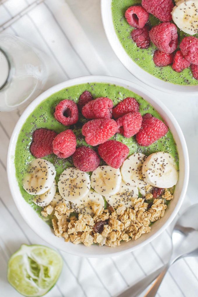 Superfood Green Smoothie Bowl! This refreshing and healthy green smoothie bowl packs two servings of fruit, 17 grams of protein, and it will provide you with your daily dose of dark leafy greens. What’s not to love? Made with banana, almond milk, nonfat Greek yogurt, kale (or spinach), cucumber, green apple, and a squeeze of lime juice.
