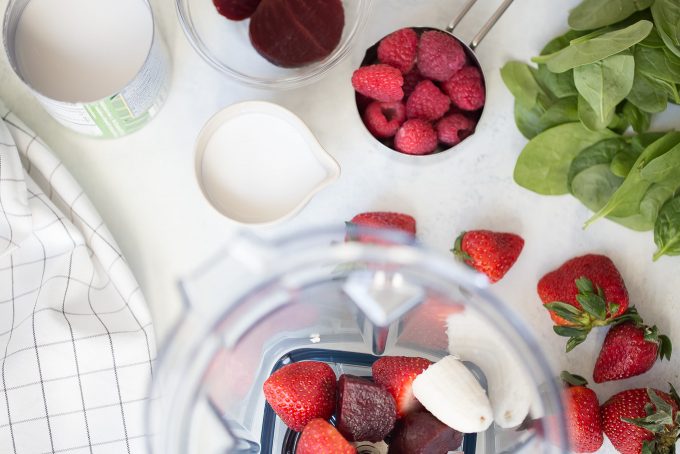 Triple Berry Beet Smoothie Recipe - a healthy smoothie made with raspberries, strawberries, blueberries, beet, banana, coconut milk, almonds, and chia seeds! 230 calories for the smoothie alone, 340 calories with toppings! 