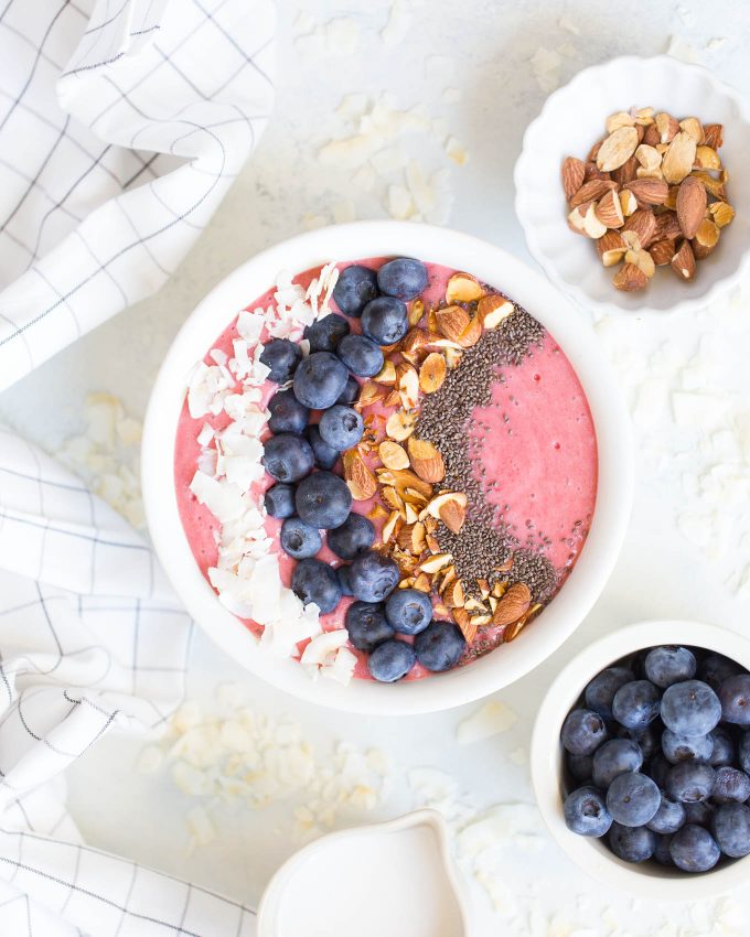 Triple Berry Beet Smoothie Recipe - a healthy smoothie made with raspberries, strawberries, blueberries, beet, banana, coconut milk, almonds, and chia seeds! 230 calories for the smoothie alone, 340 calories with toppings! 