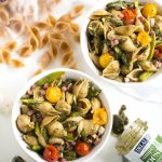 Whole Wheat Pasta Salad with Pesto, Asparagus and Roasted Tomatoes - A flavor-packed pasta salad can be easy and healthy, too, and this recipe is proof. Slather DeLallo whole wheat shells in basil pesto, then toss them with roasted asparagus, sweet blistered tomatoes, charred artichokes, and salty bits of prosciutto. All this for only 249 calories per serving